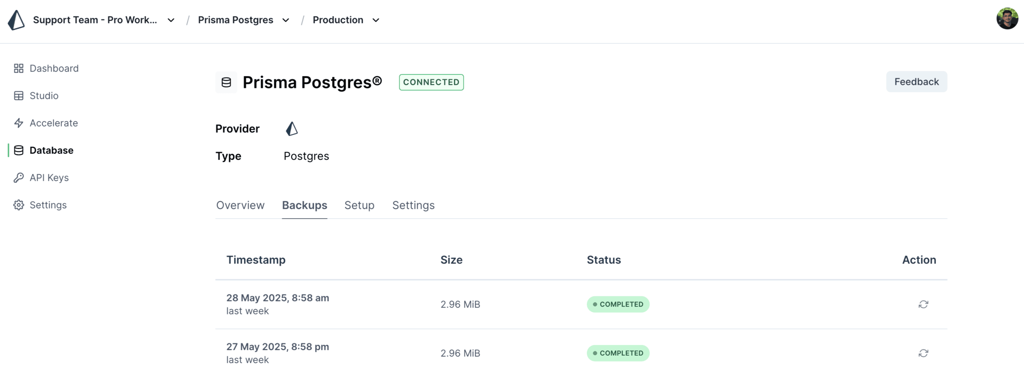 Prisma Console interface showing the backup tab for a Prisma Postgres database instance, with options to view and restore completed backup snapshots.